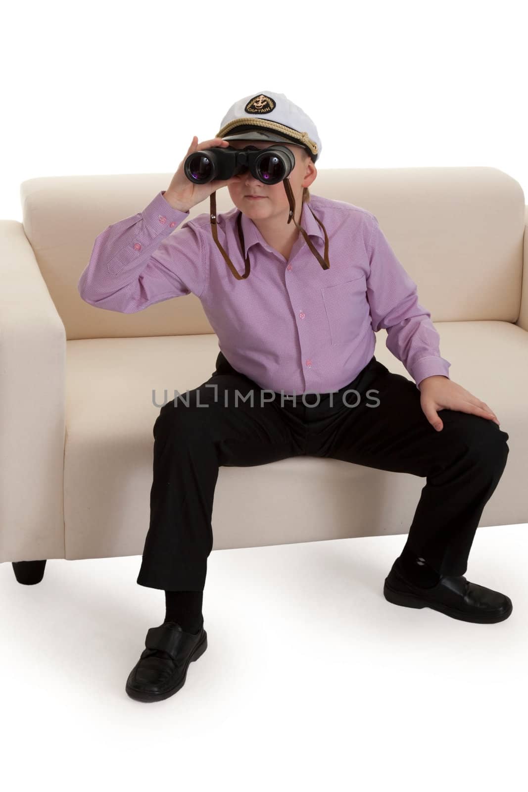 Strict boy with glasses and a cap Captain