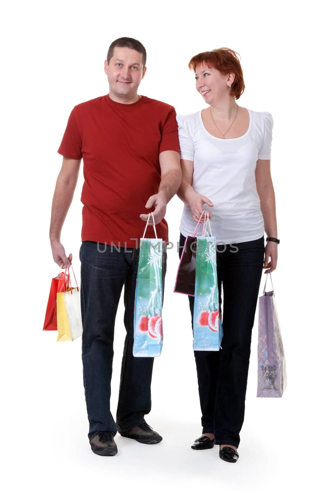 young couple with shopping bags on white background
