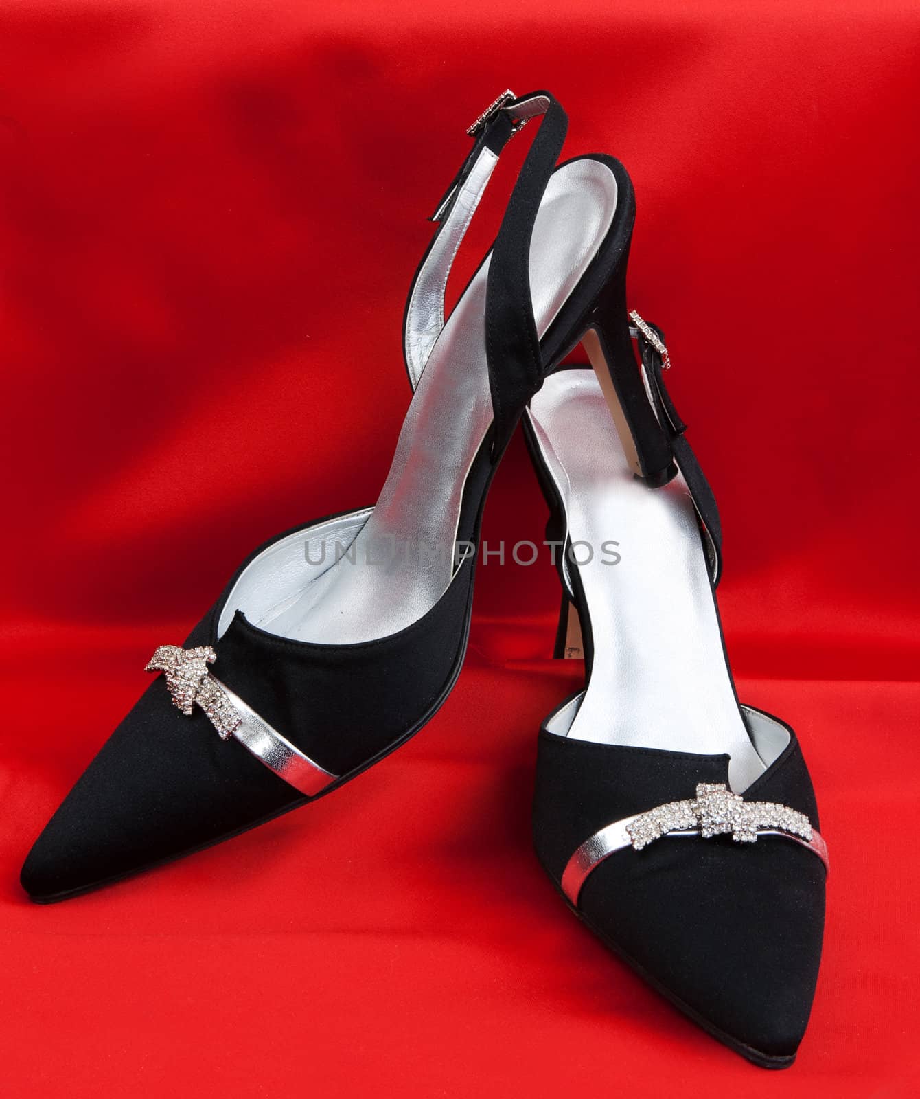 Pair of black women's shoes on a white background