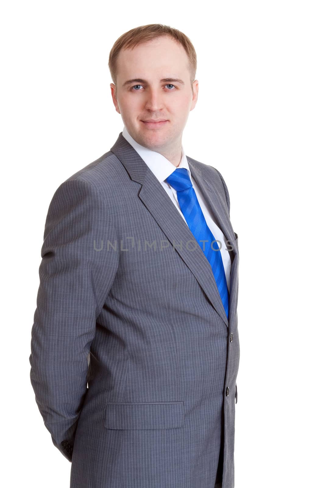 Portrait of a businessman in a gray suit and blue tie
