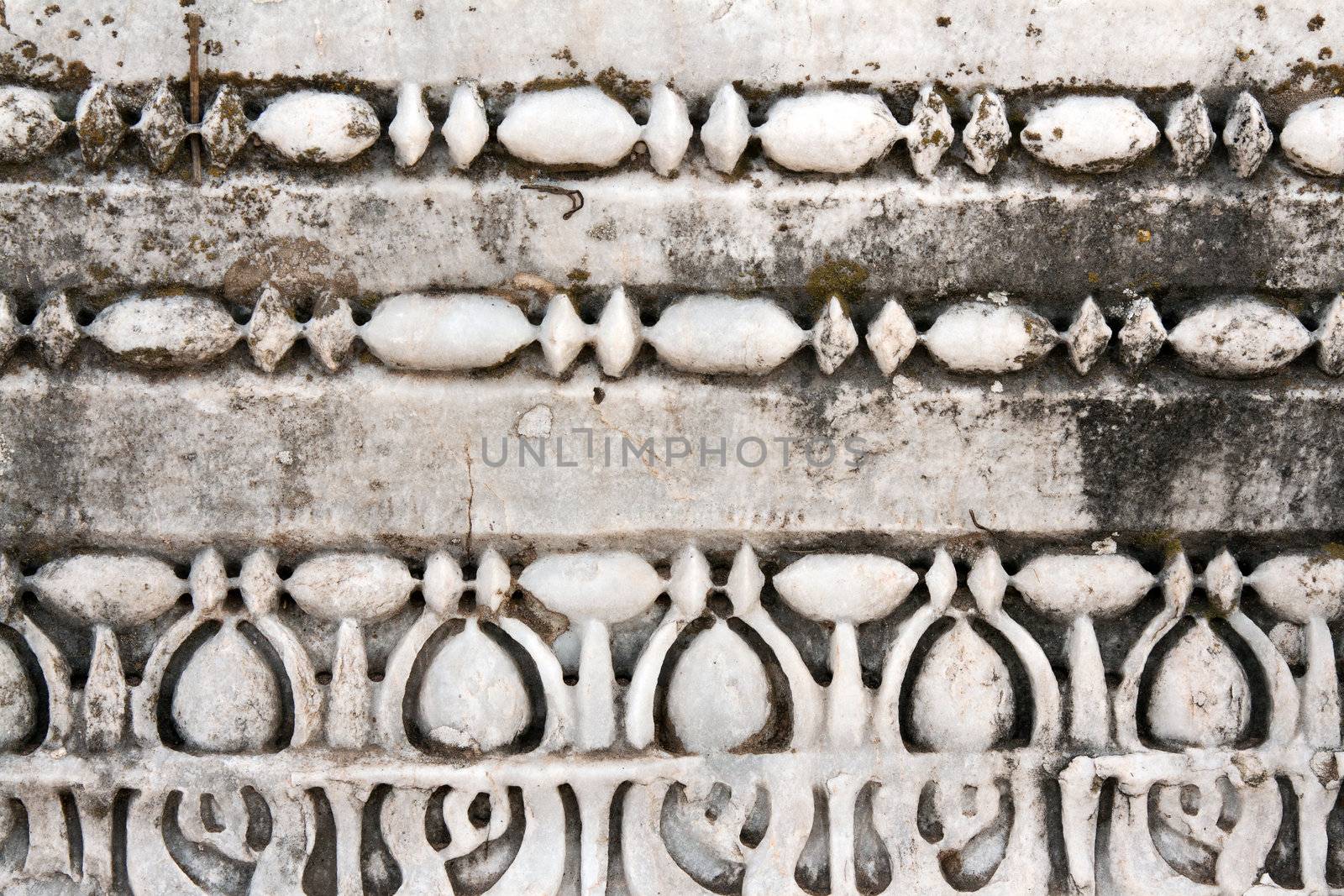Carved patterns in the old white marble