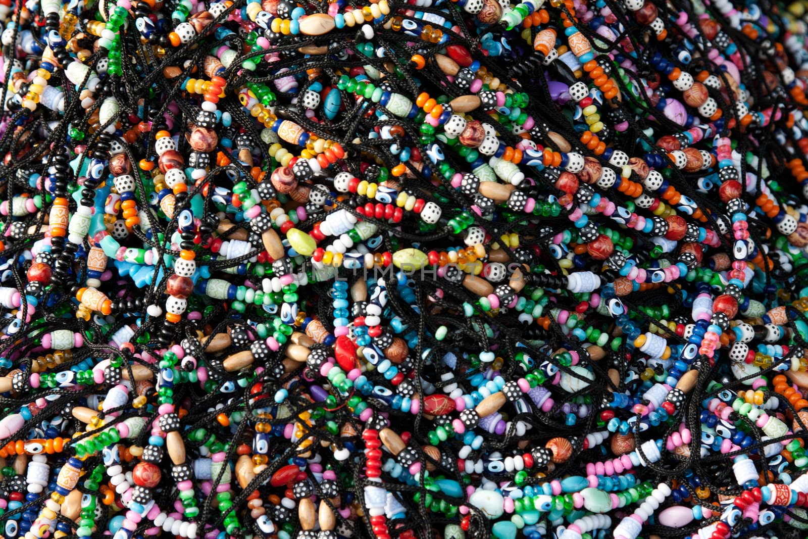 Bracelets with dice, and amulets in the heap