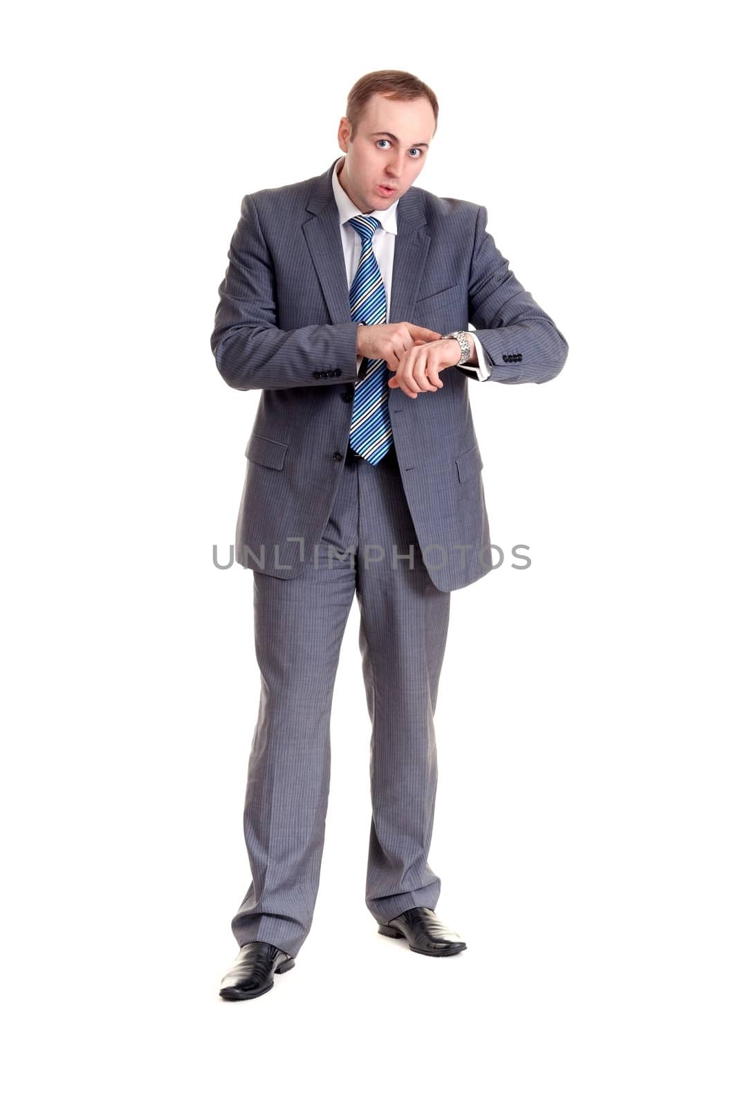 businessman looking with amazement at his watch in his hand
