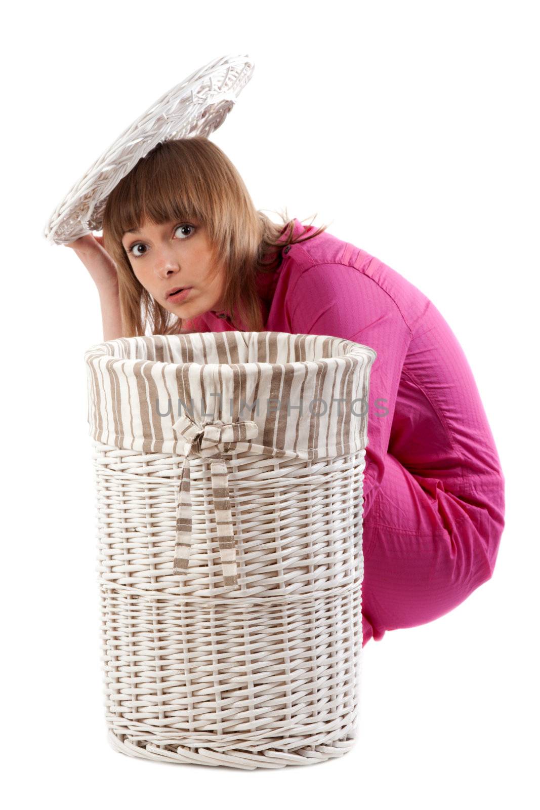 Beautiful girl to hide for basket for linen