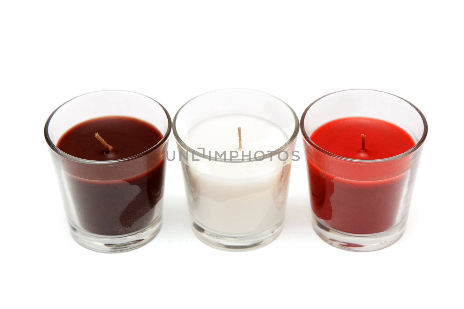 Three glass candlesticks with colour aromatic candle