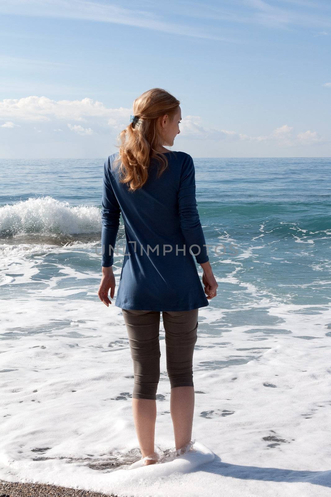 The girl on the beach in a dress