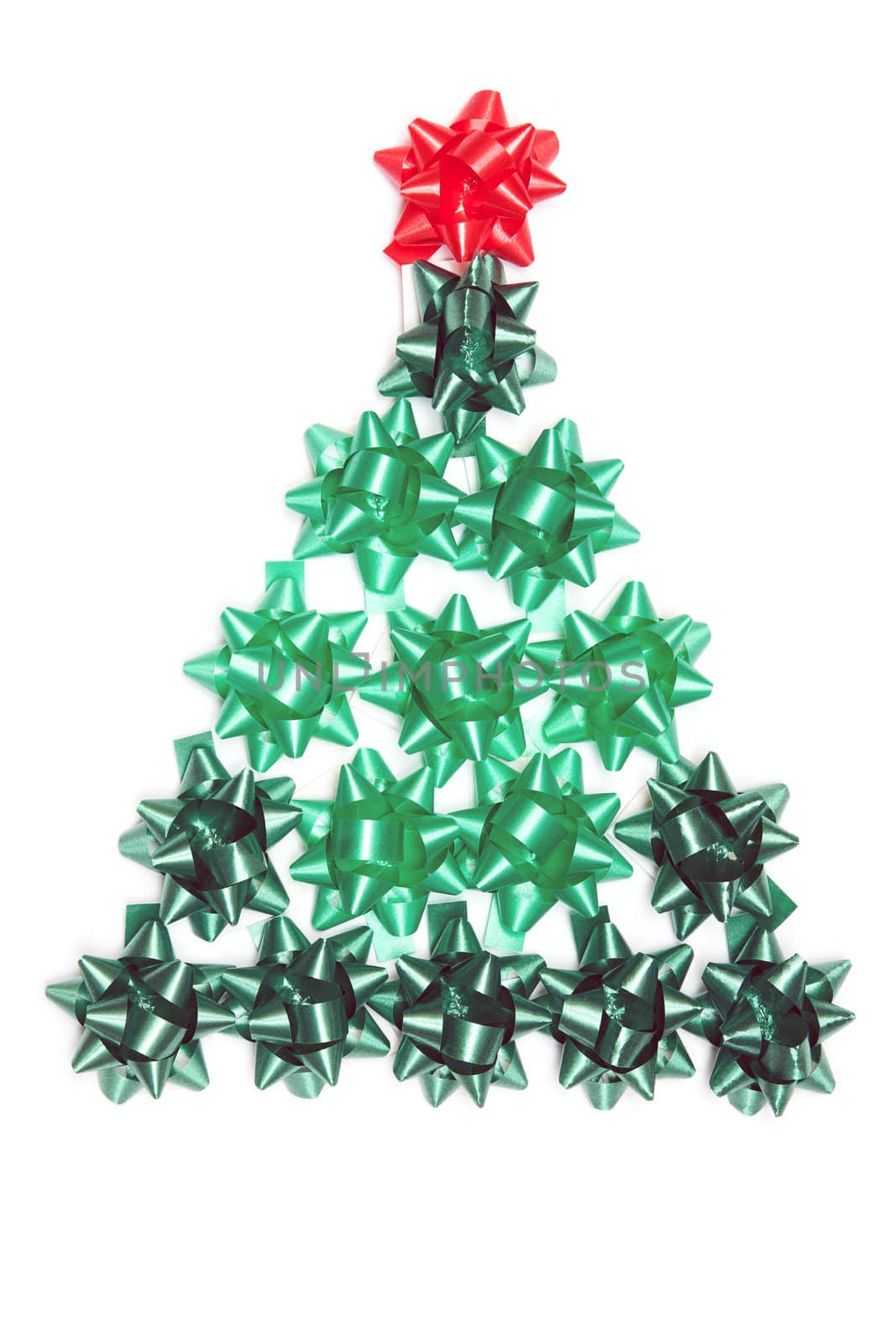 Spruce from green gift ribbon on a white background