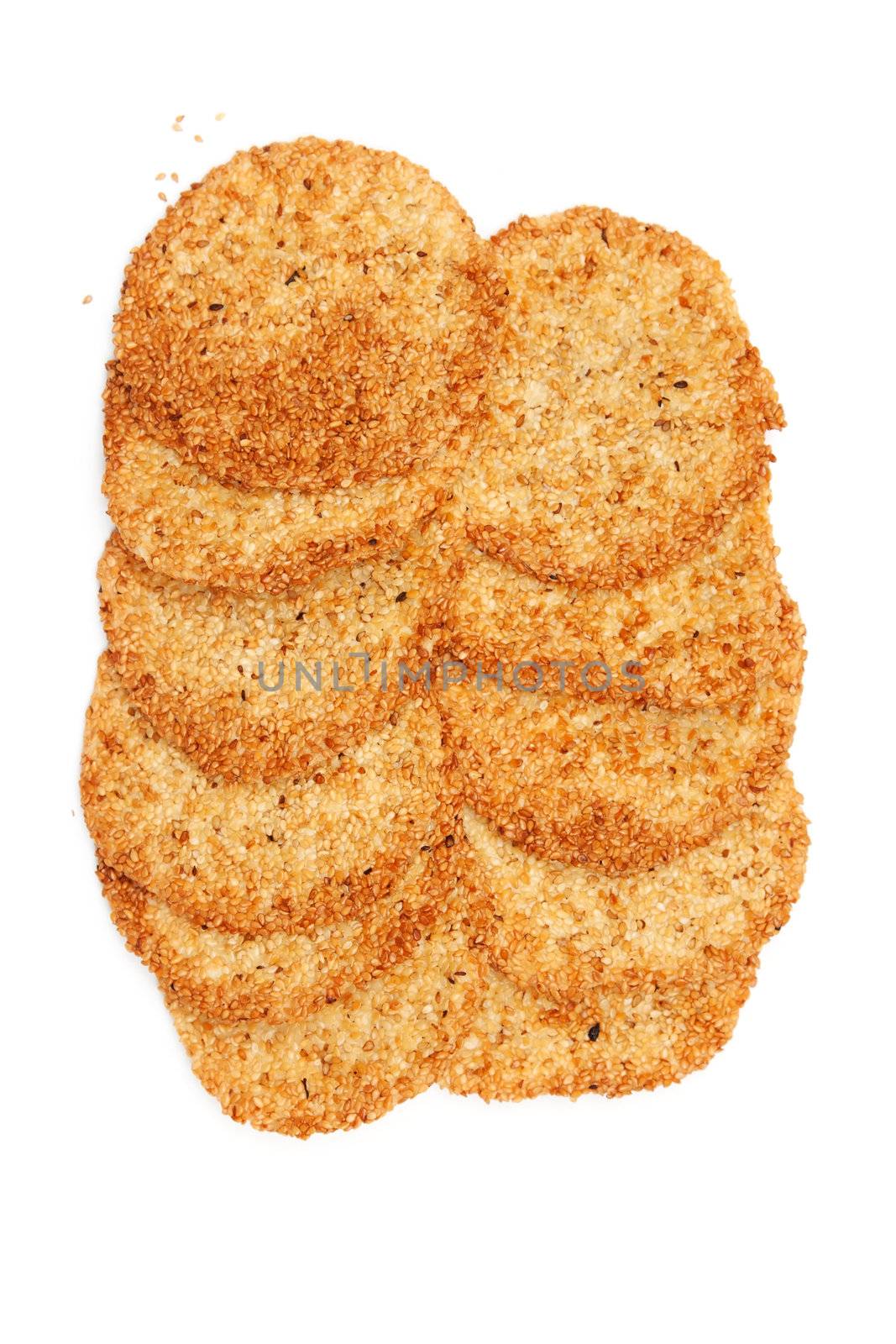 Biscuits with sesame seeds on a white background