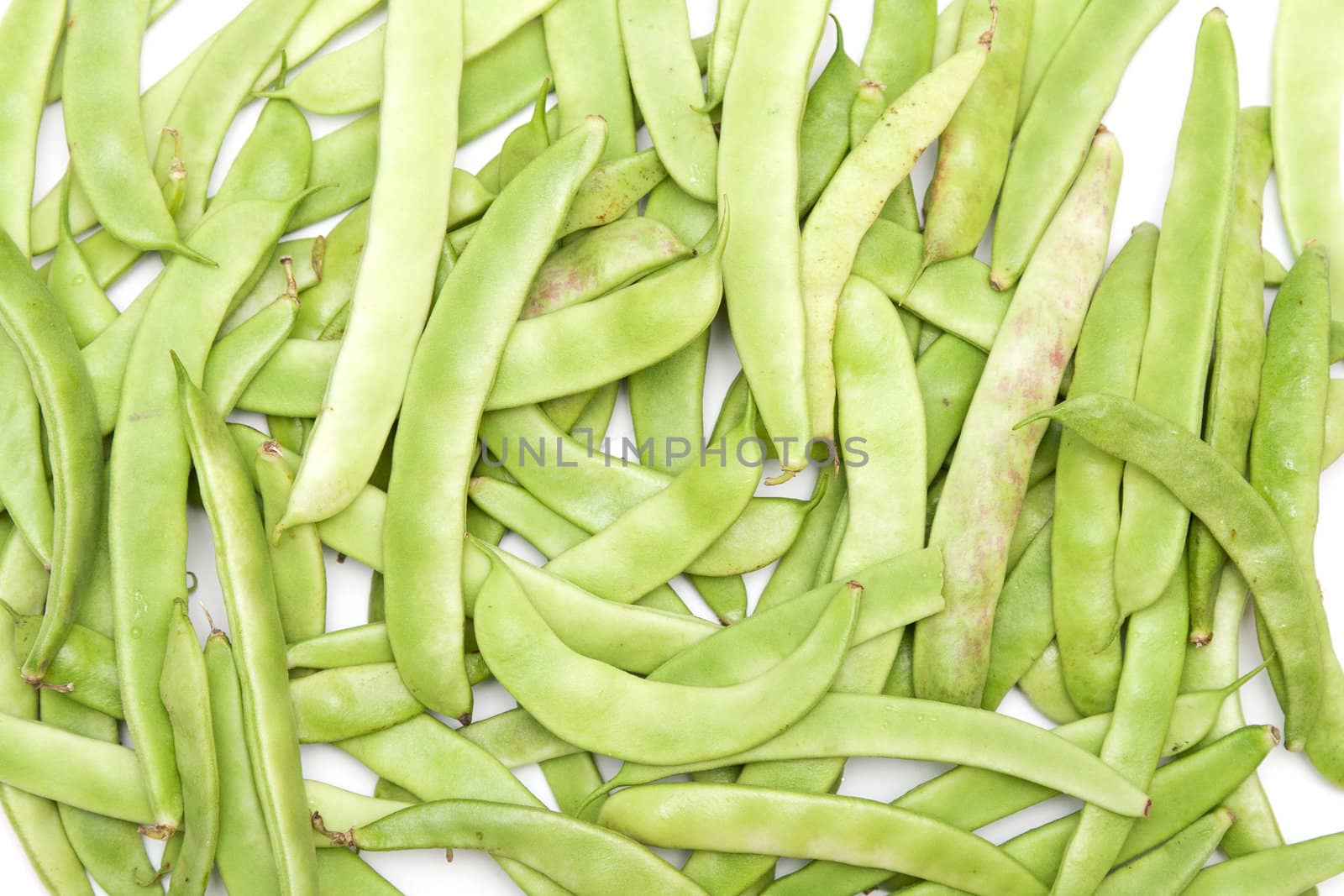 Green beans in the form of a white background