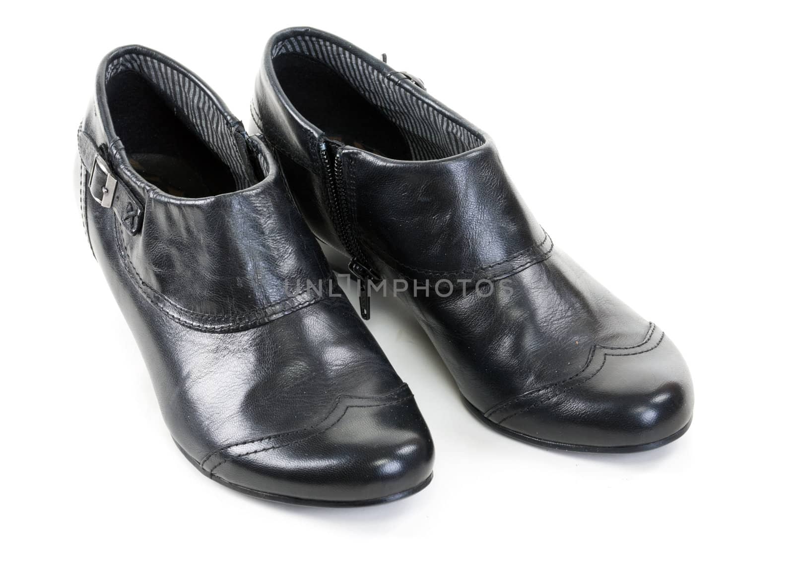 pair of black leather women's shoes on a white background