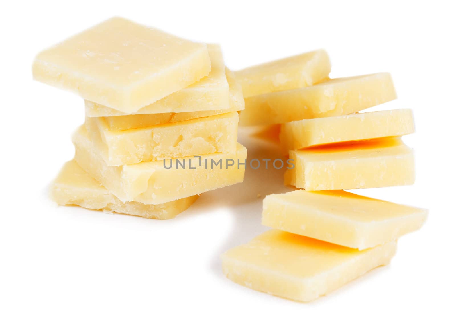 aged cheese, sliced isolated on a white background