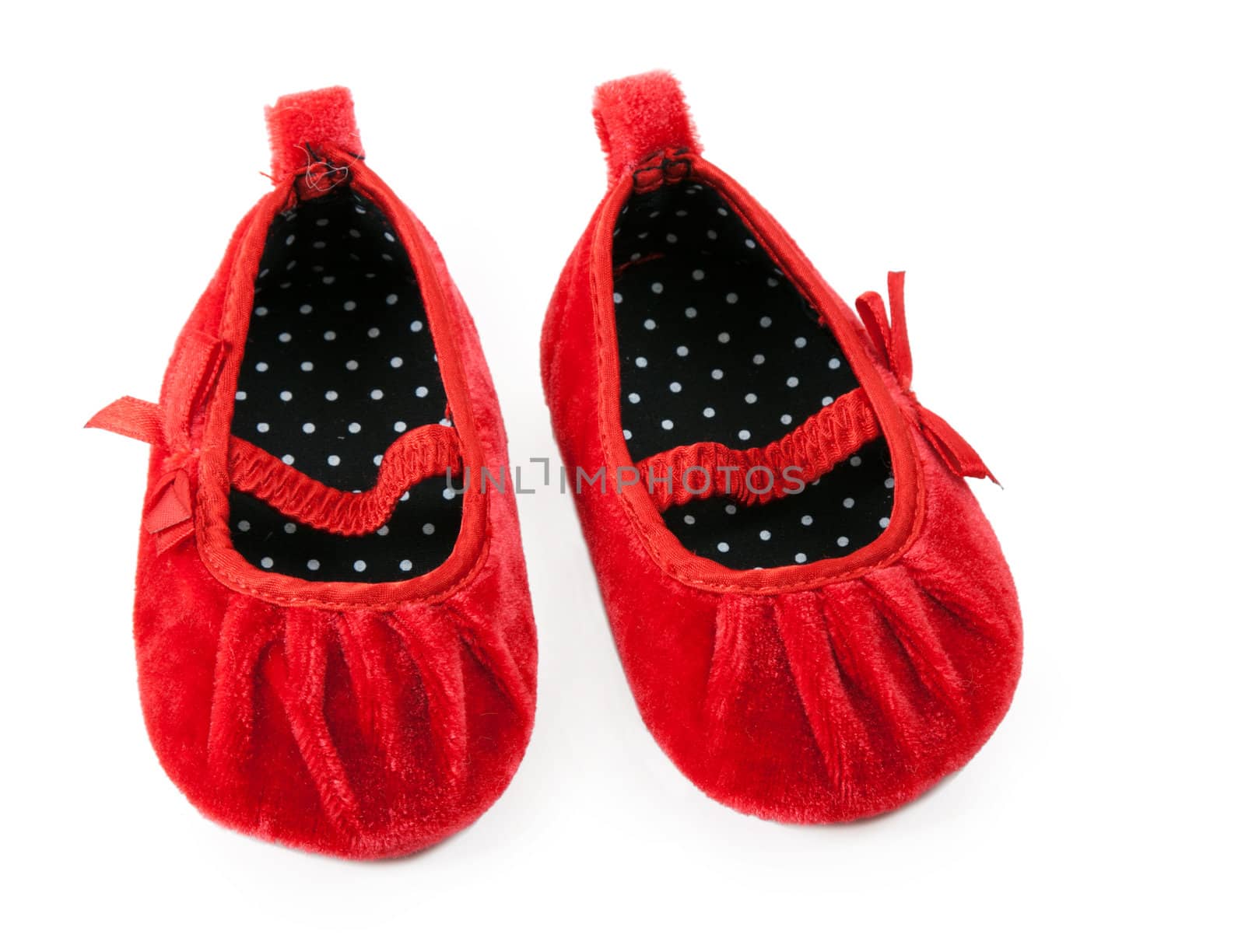 red baby booties isolated on white background