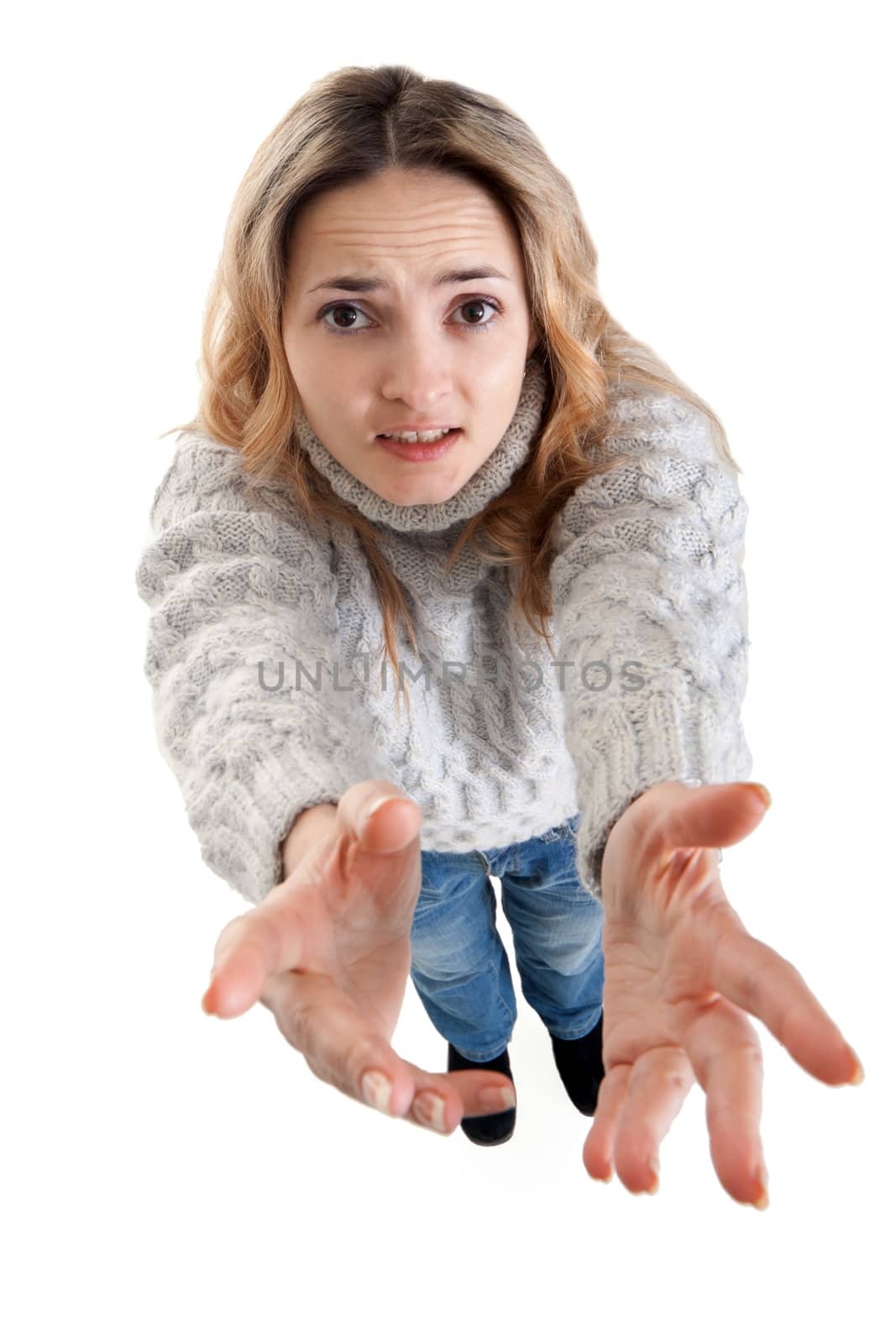 plaintively beautiful blonde pulls her hands on a white background
