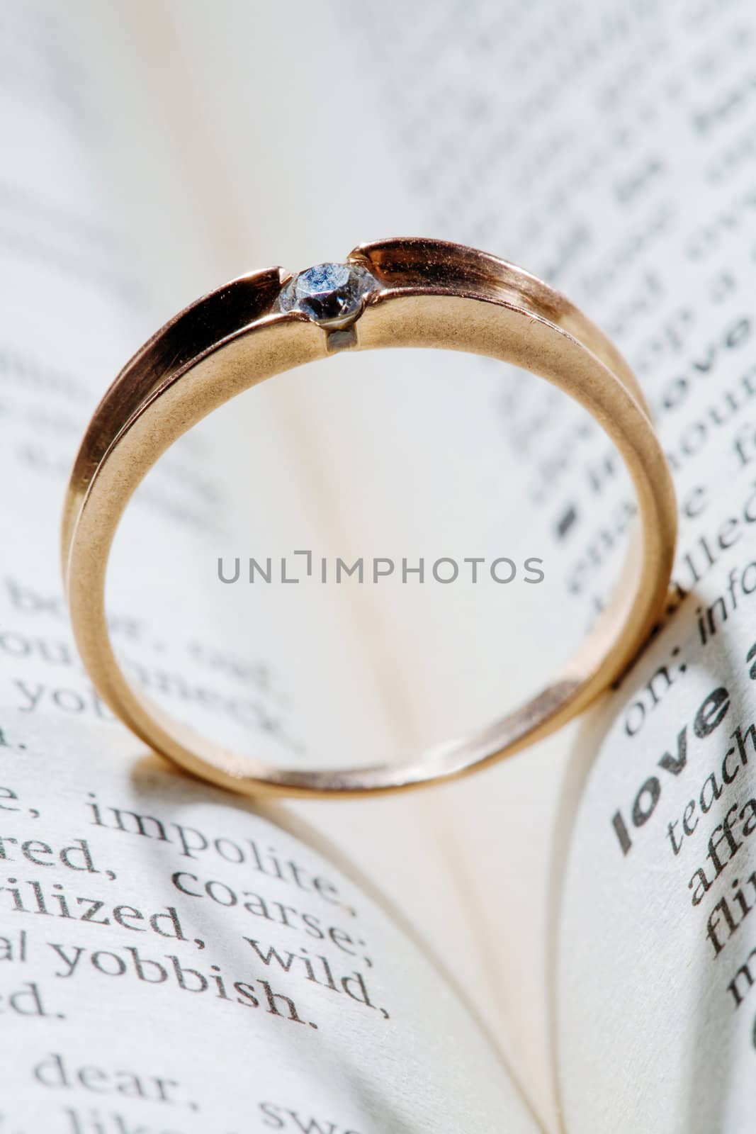An image of a ring with shadow of a heart