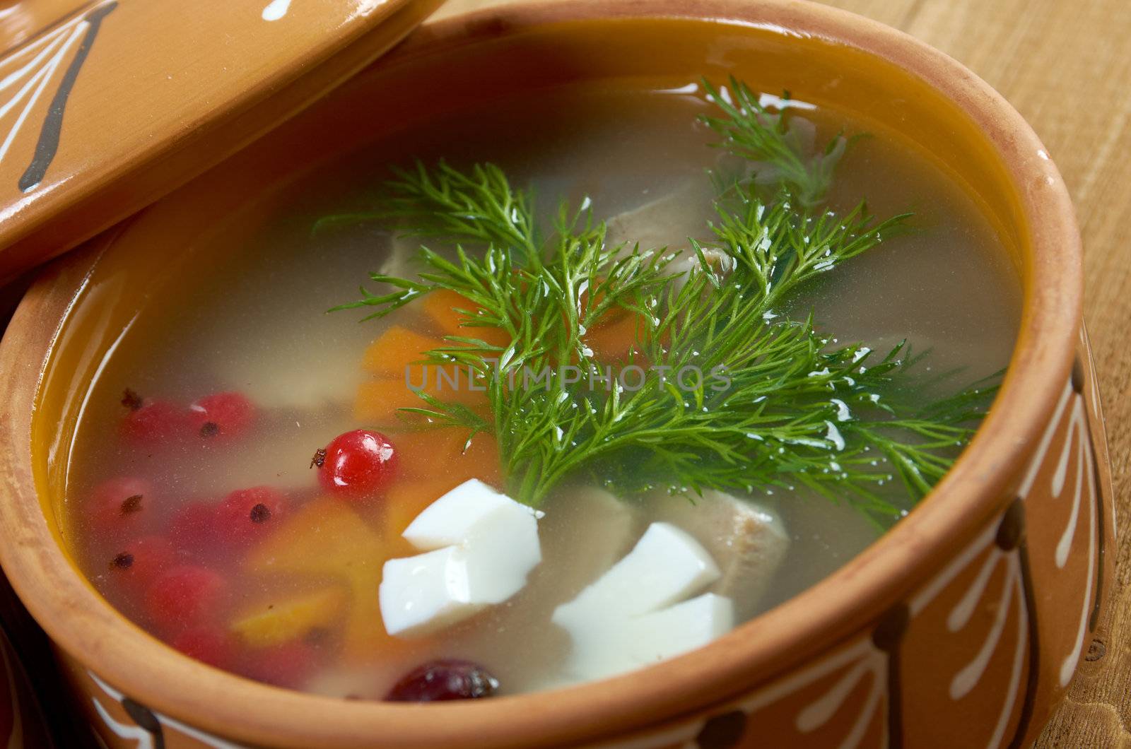 Aspic from meat decorated with egg, carrot,