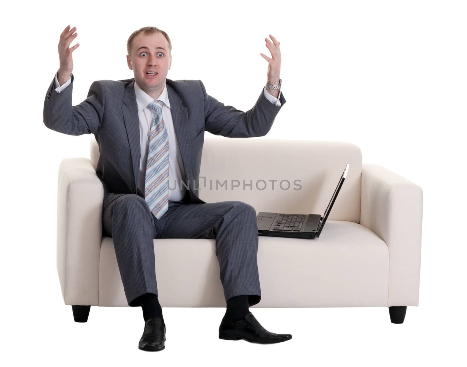businessman on the couch with a laptop