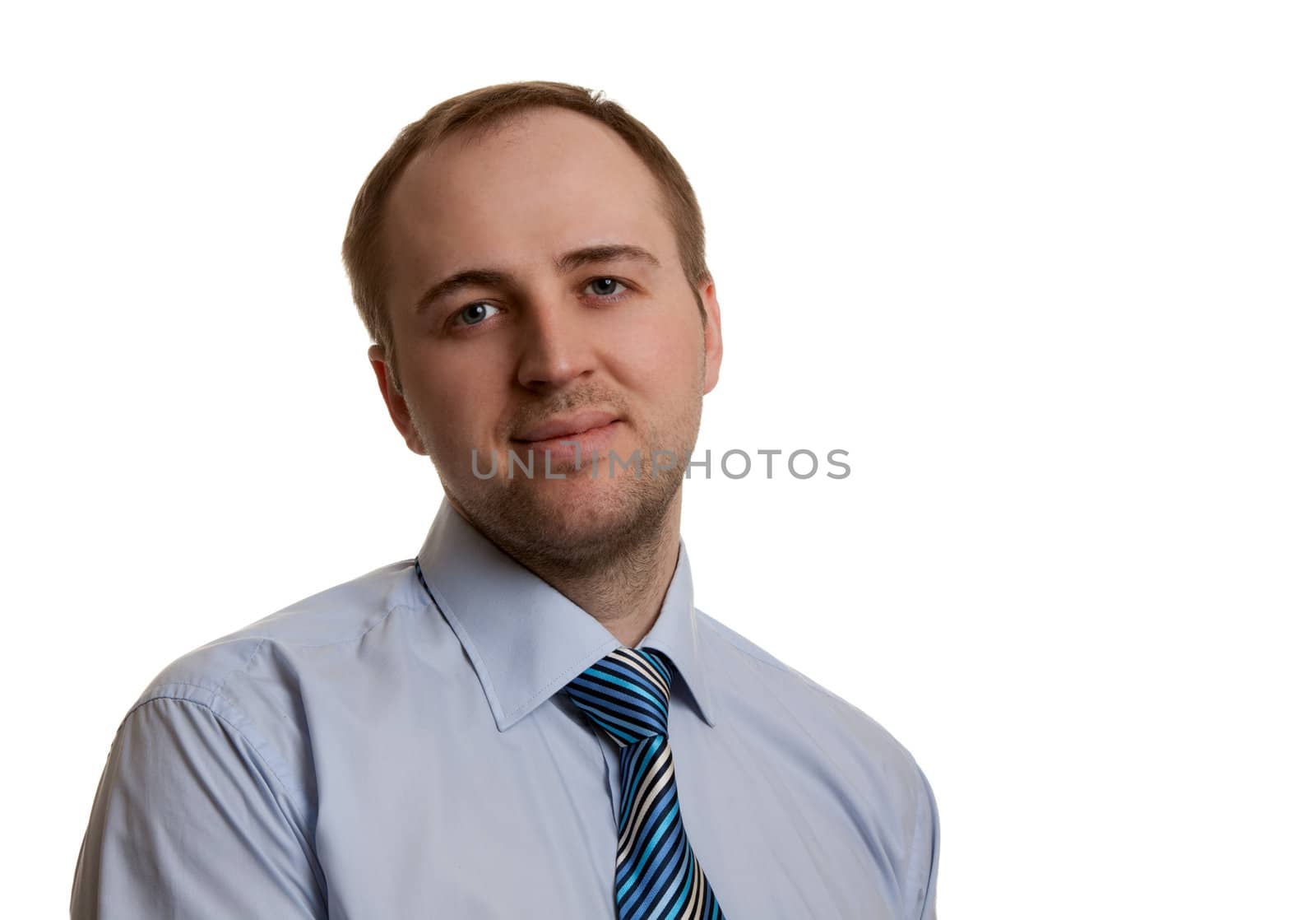 portrait of an unshaven businessman in a gray suit with a white background