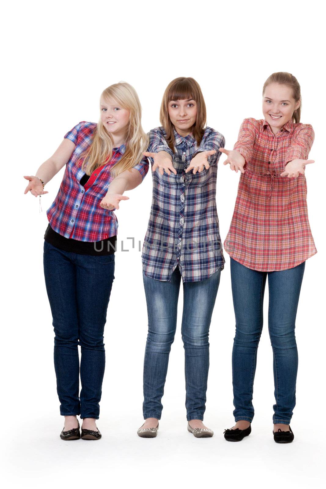 three friends on a white background pulling his hands to the camera