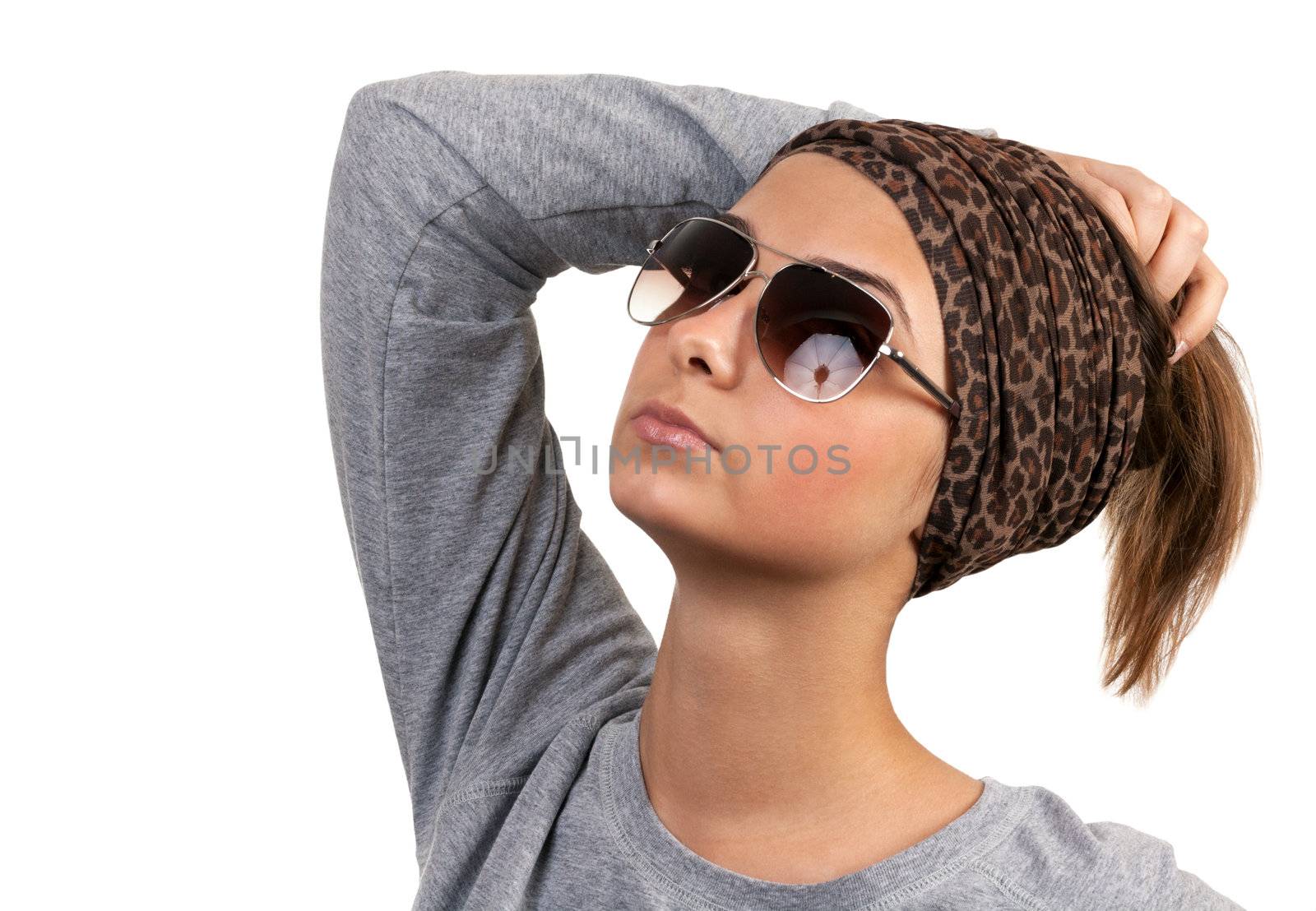 portrait of a girl with glasses in a leopard scarf on a white background