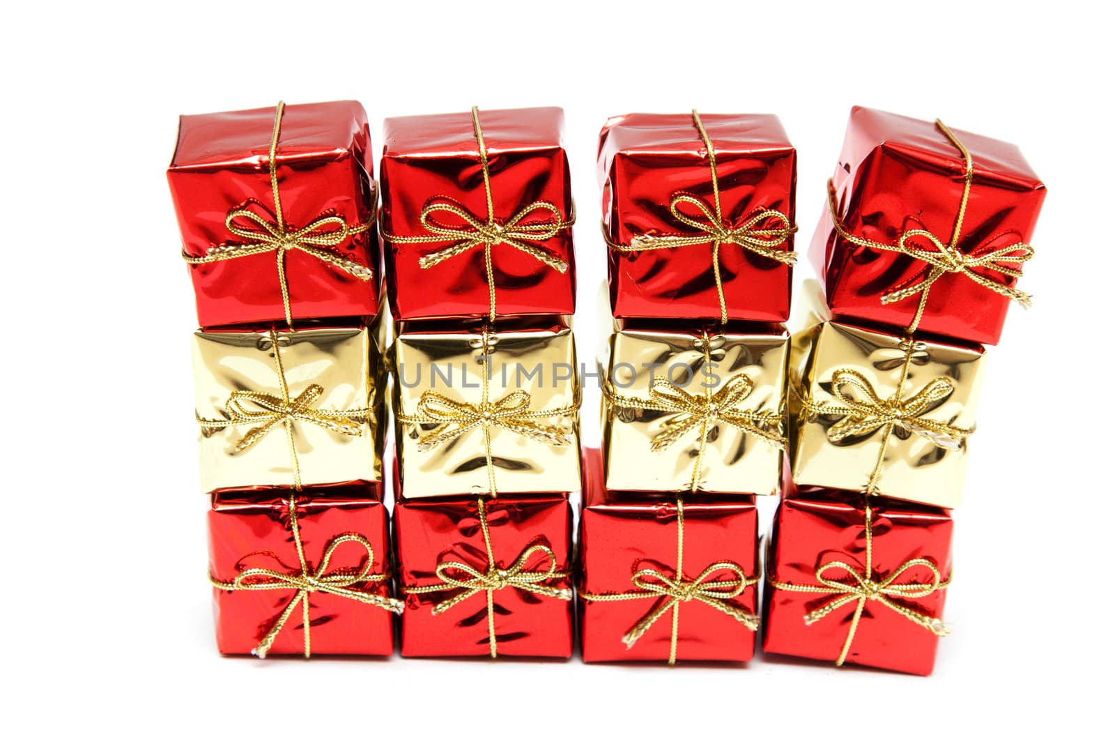 Gift red boxes with gold bows on a white background
