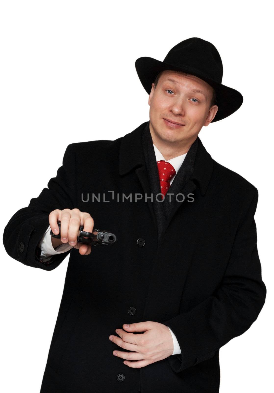 man in a black coat and hat with a gun on a white background