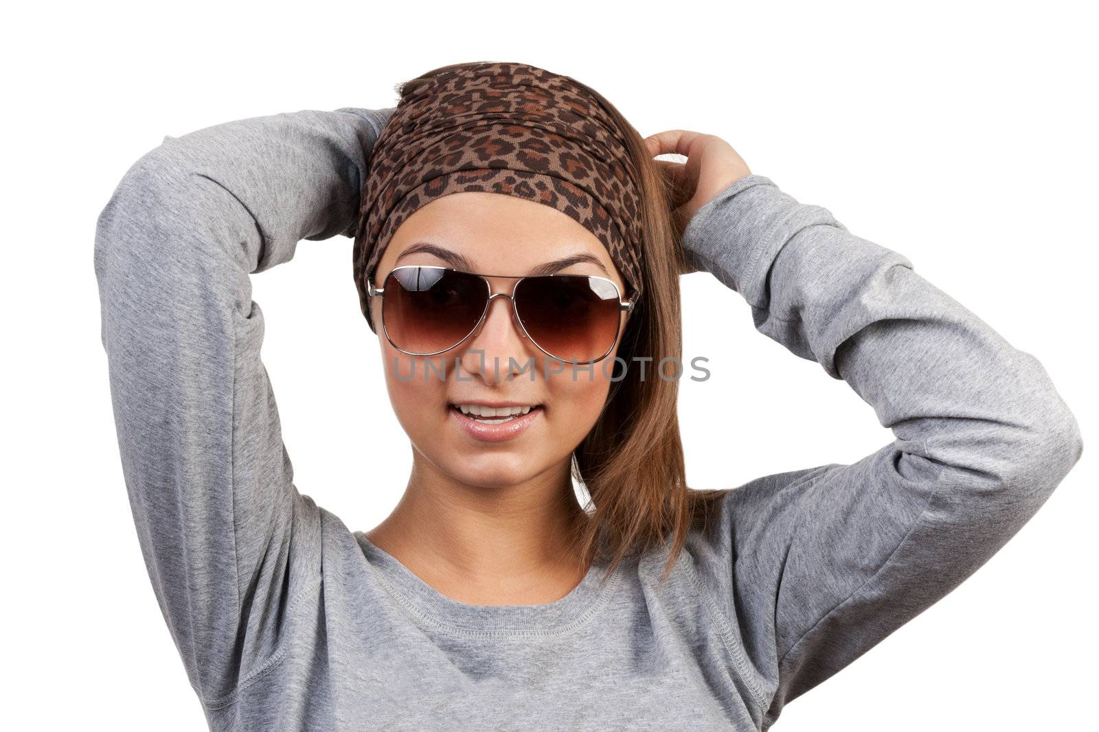 portrait of a girl with glasses in a leopard scarf on a white background