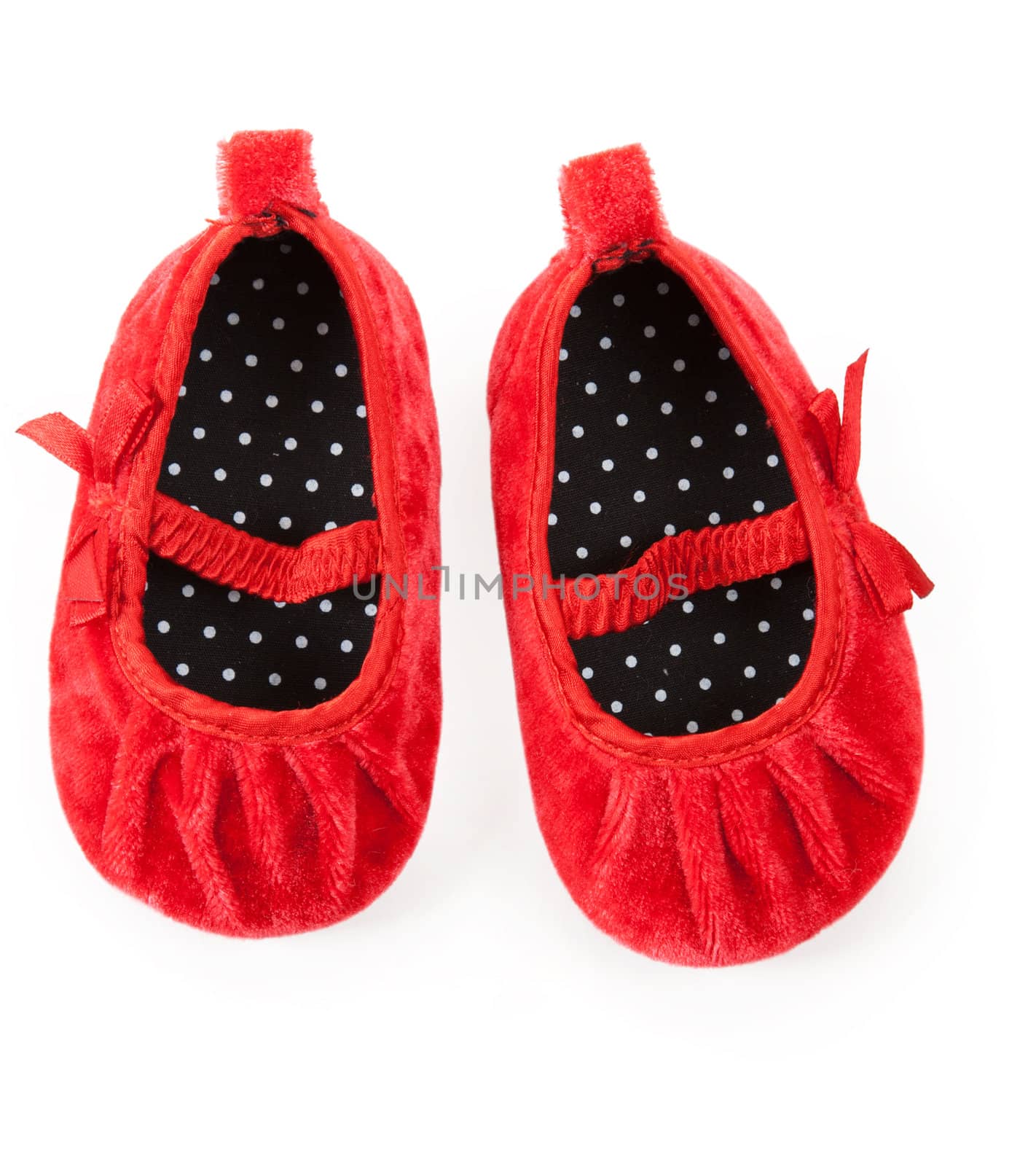 red baby booties isolated on white background
