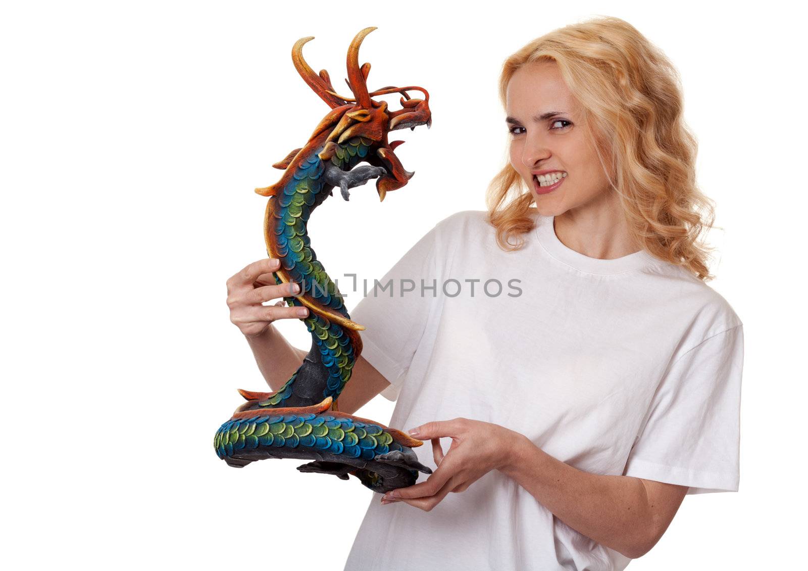 beautiful girl with a wooden dragon isolated on a white background