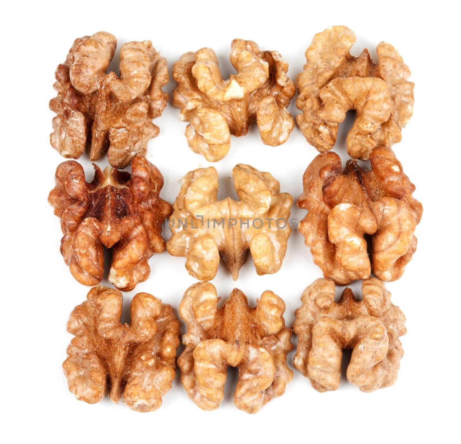 nine walnut halves isolated on white background