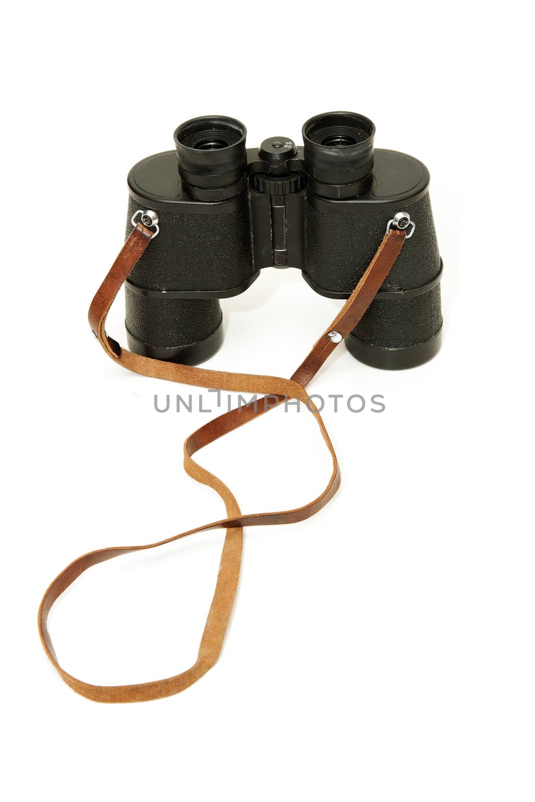 Old black glasses with a leather strap on a white background