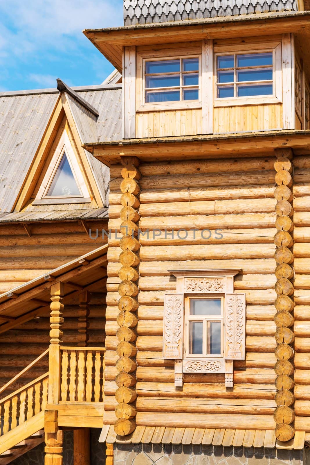 Wooden blockhouse with decorated windows, Russian traditional architecture.