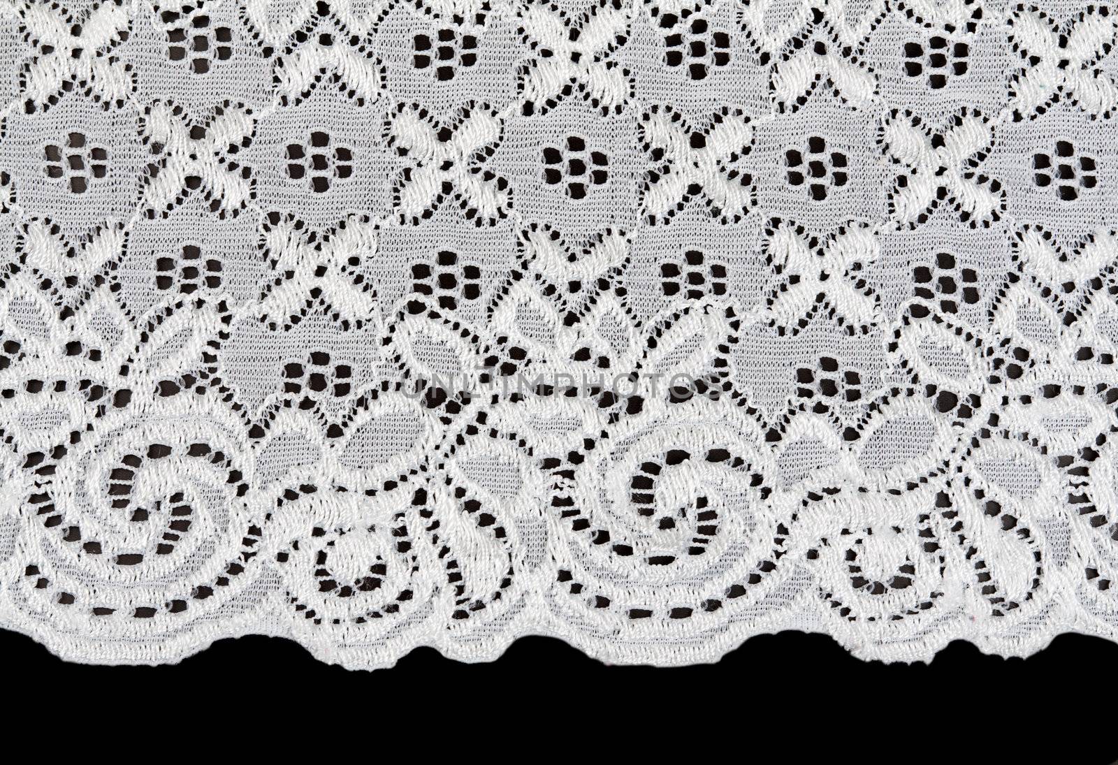 white lace with a floral pattern on a black background