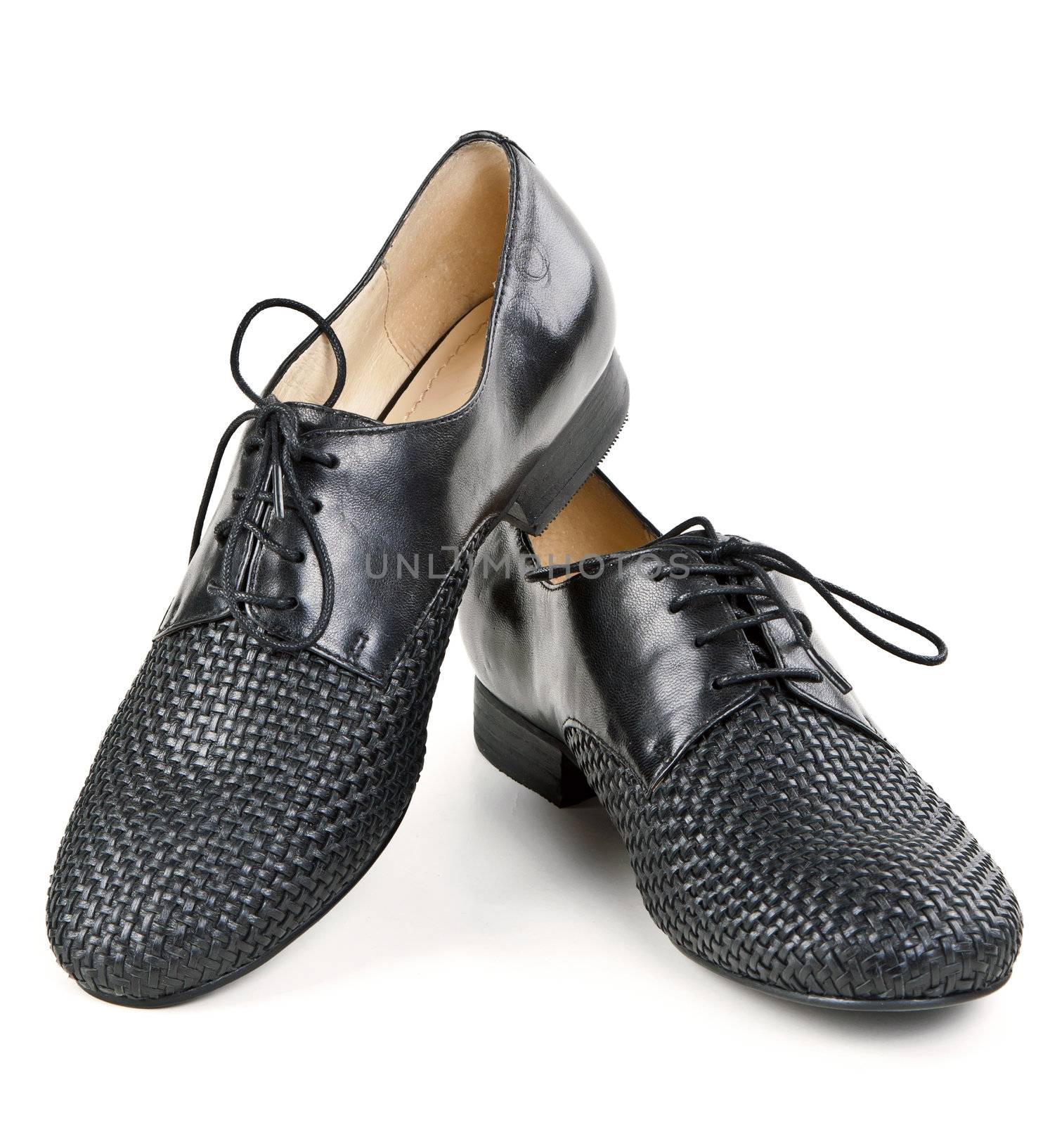 stylish pair of black leather shoes on a white background