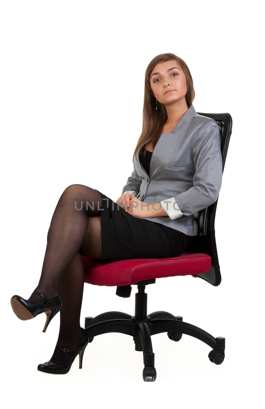 Business woman sitting in a chair isolated on white background