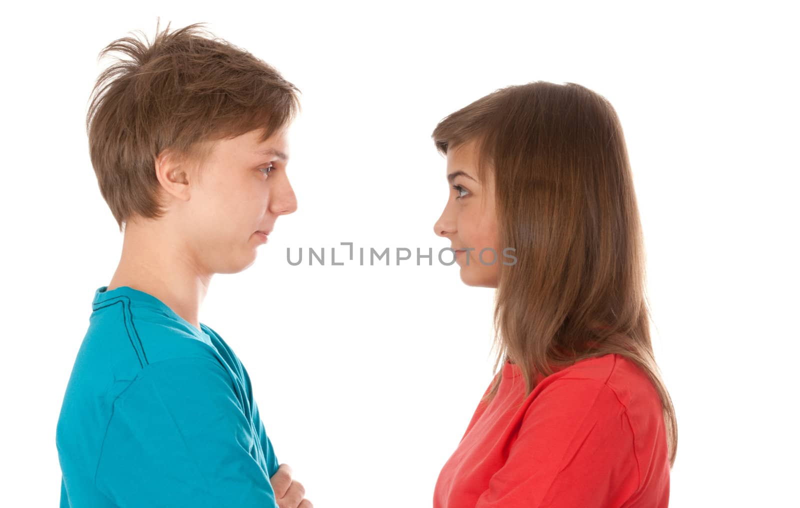pair of teenagers looked at each other on a white background
