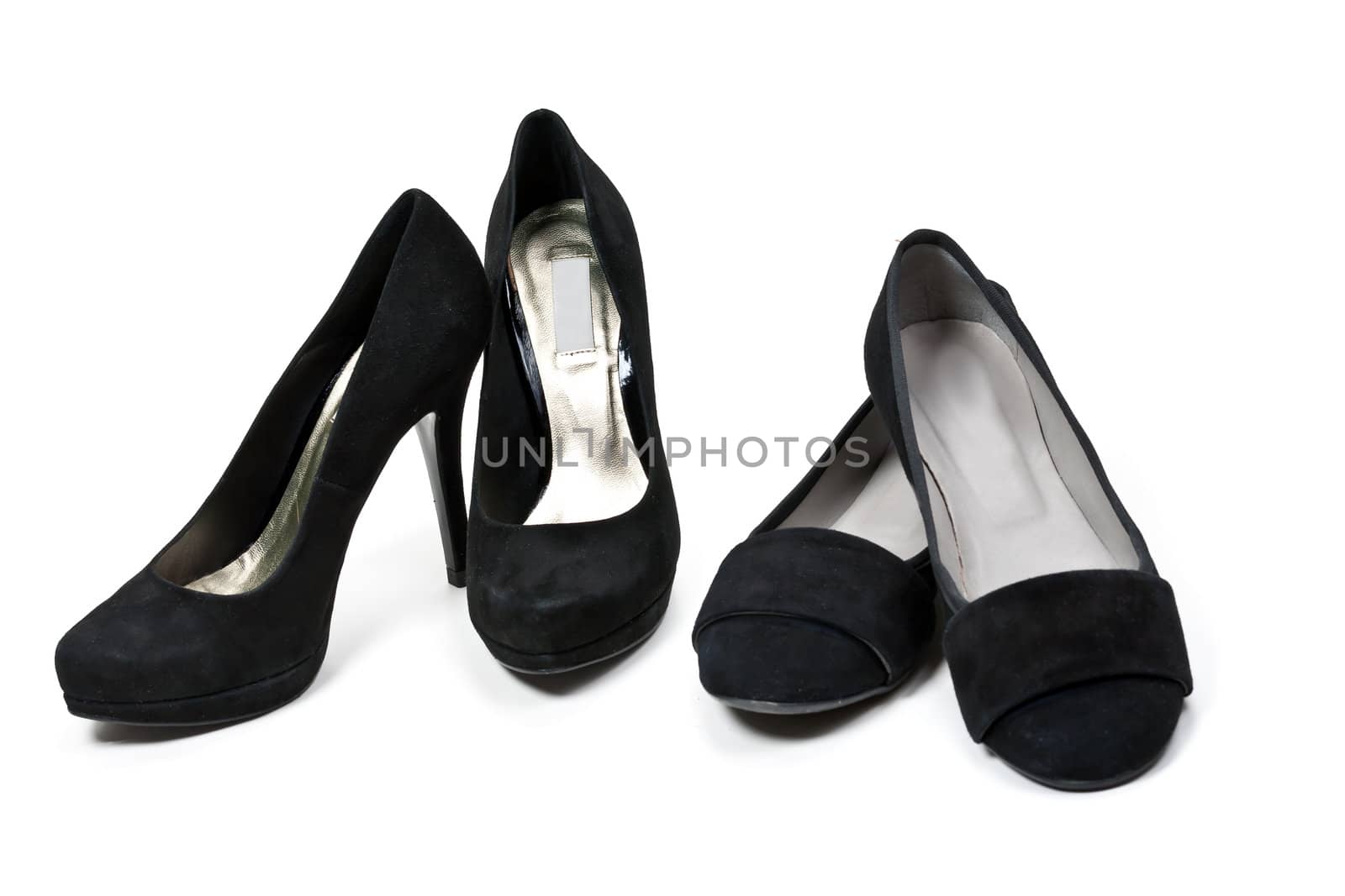 two pairs of female black suede shoes isolated on white background