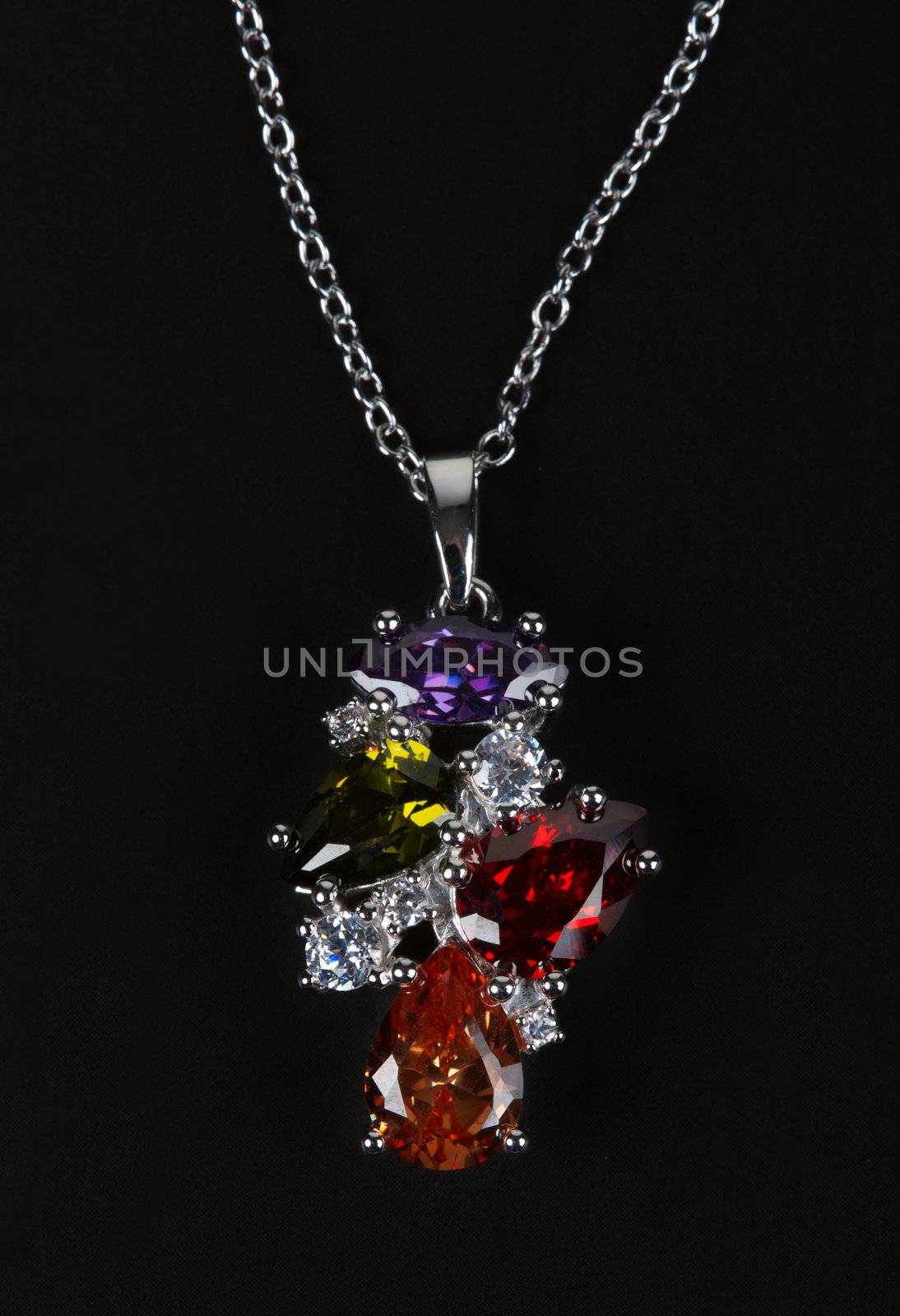 Necklace with stones with a silver chain isolated on black background