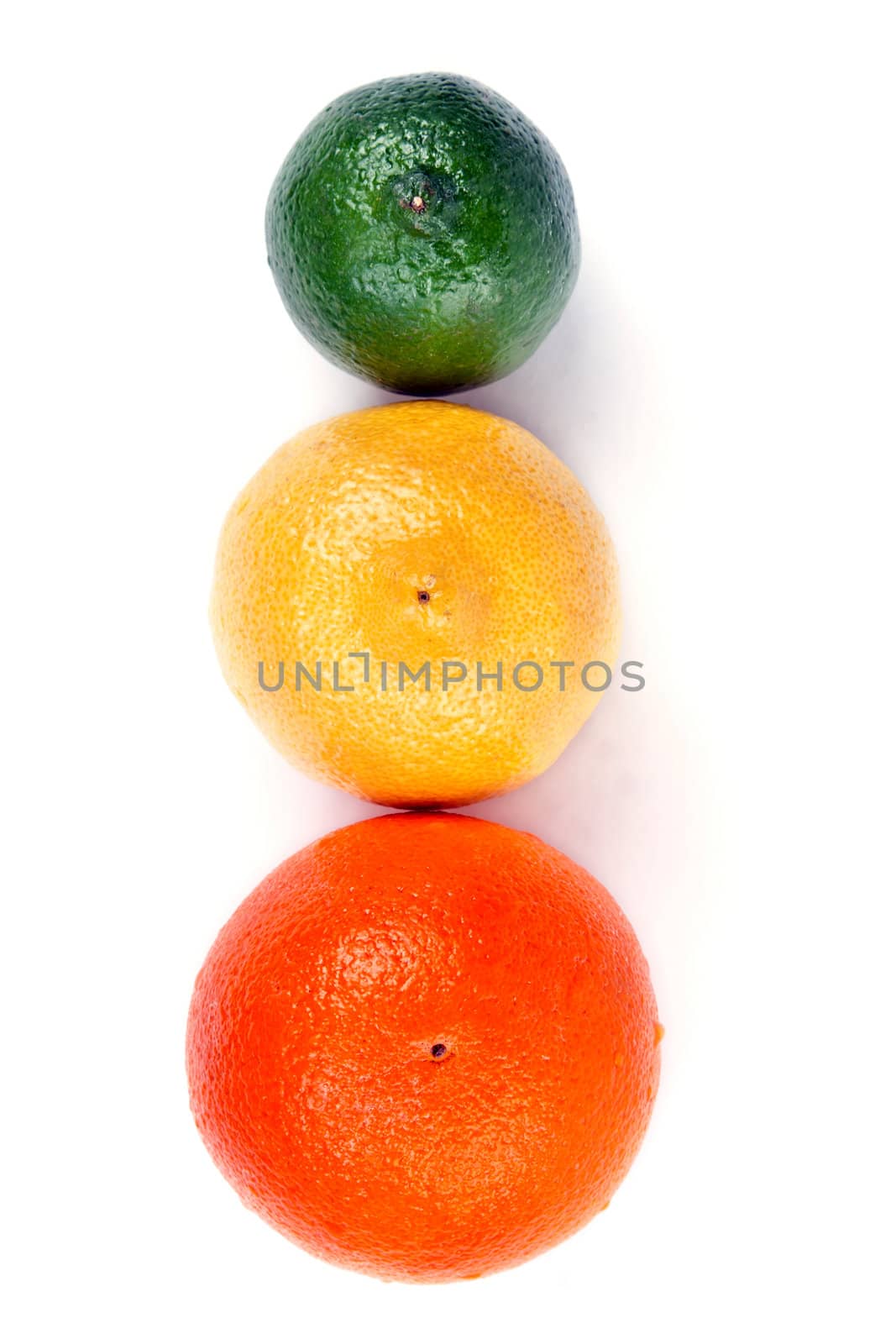 orange lemon and lime arranged in a row on a white background