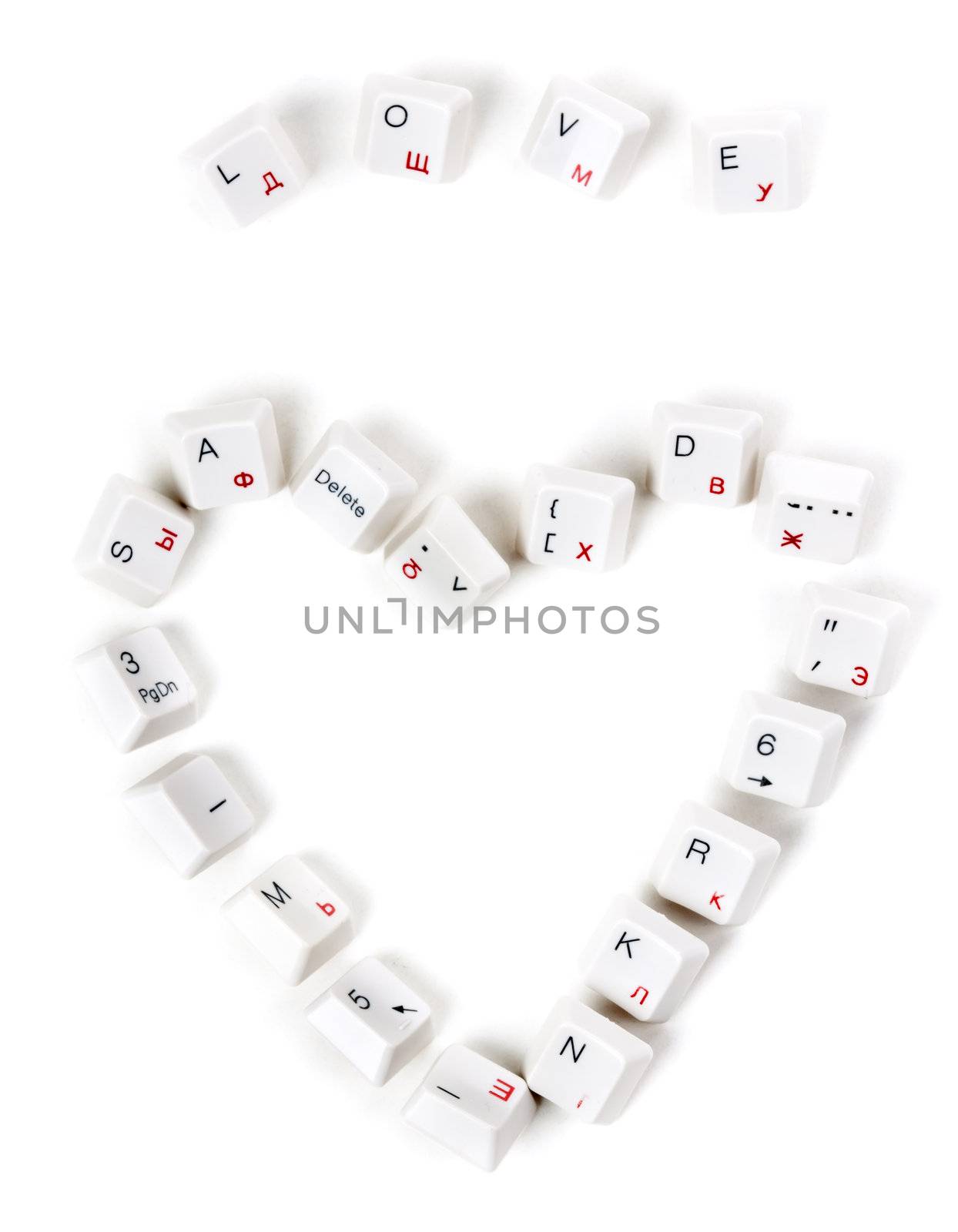 word love and the heart laid out keys from the keyboard on a white background