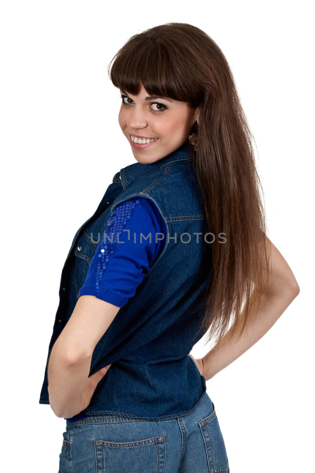 girl in denim shorts turns back on a white background