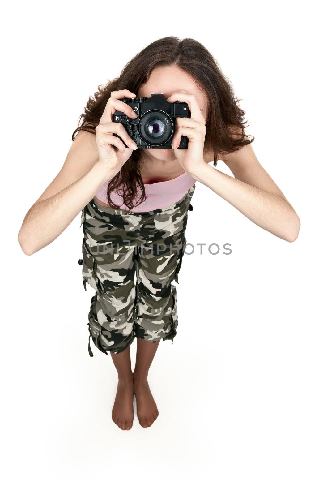 girl in khaki pants photographed on a white background