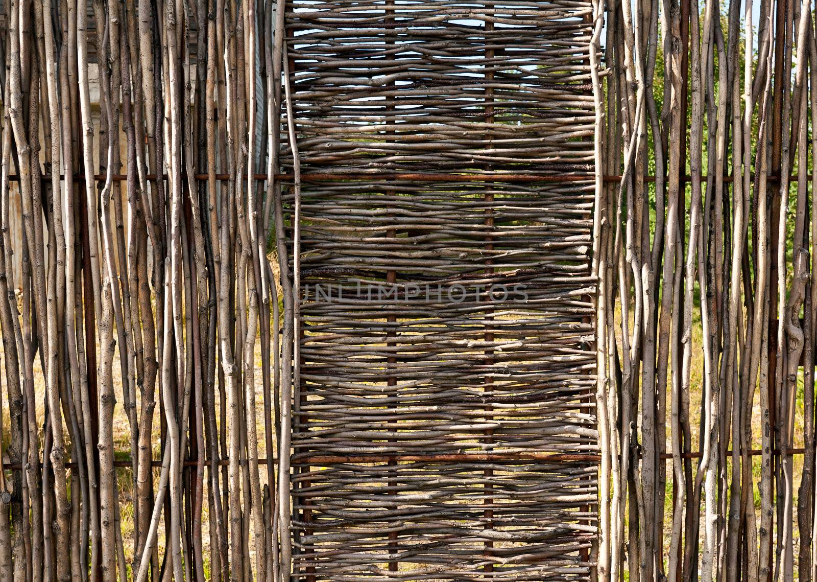 woven wooden fence of twigs of hardwood