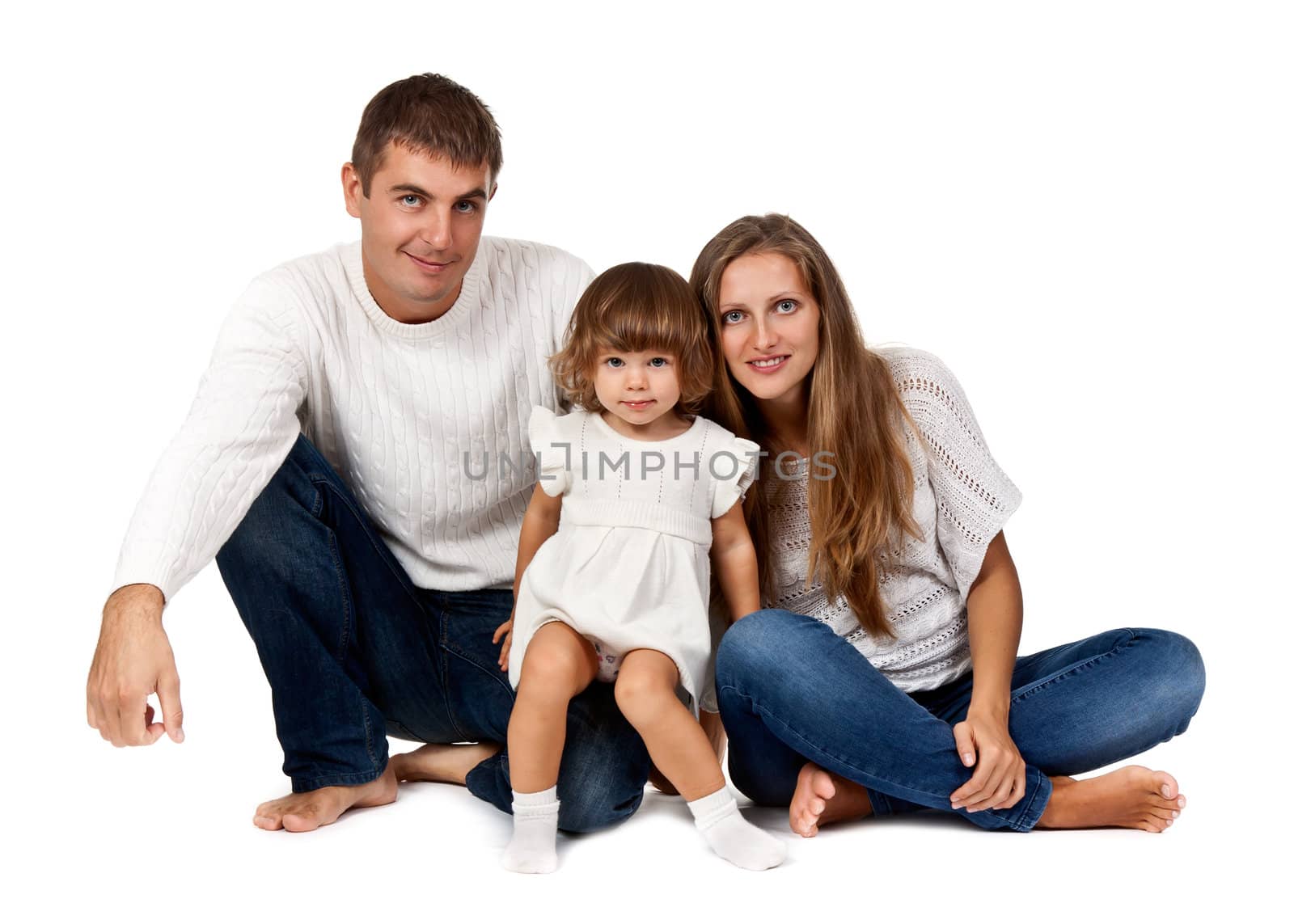 happy family sitting in the studio on a white background