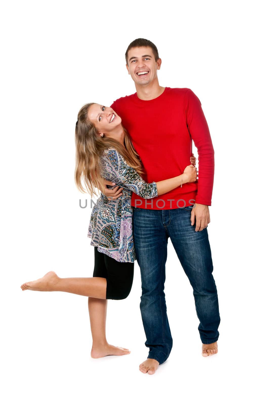 loving couple embracing in studio on white background