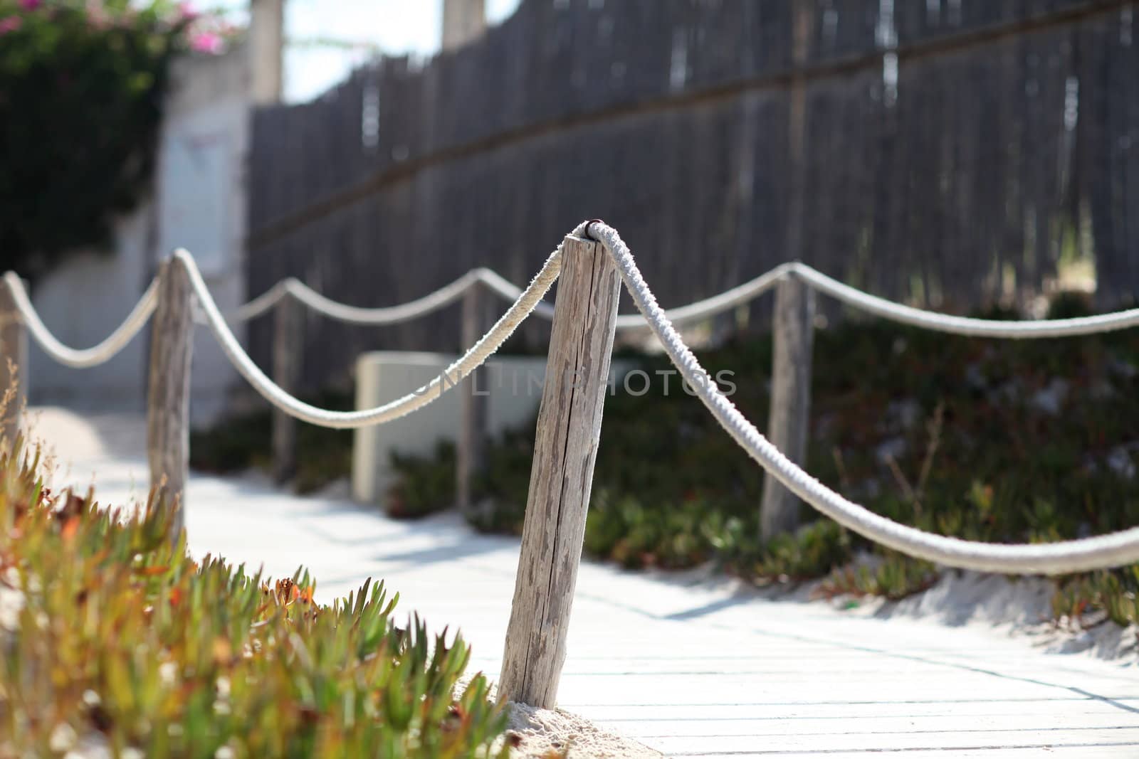 pavement fenced thick marine rope
