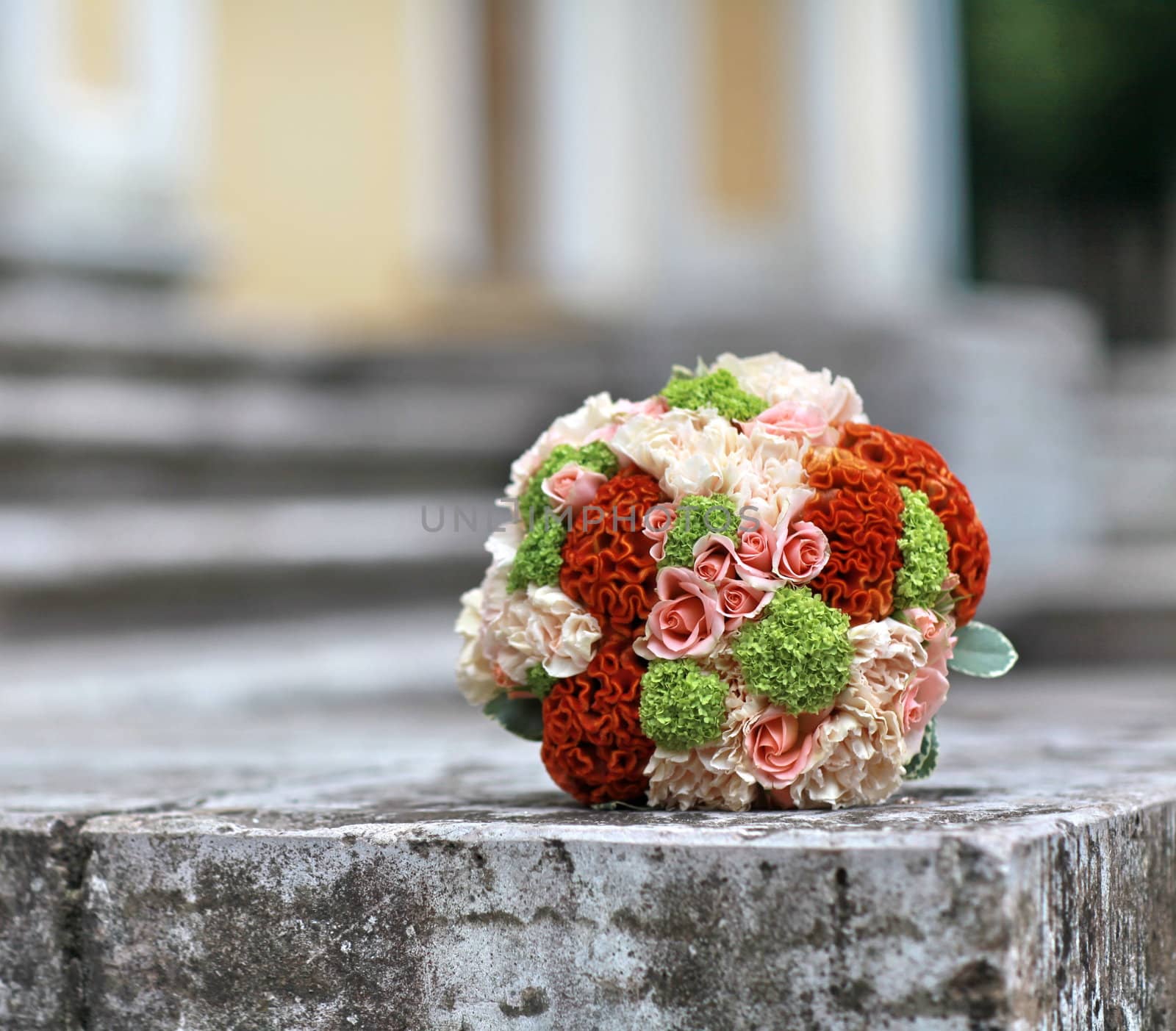 bouquet of bright flowers on the stone steps