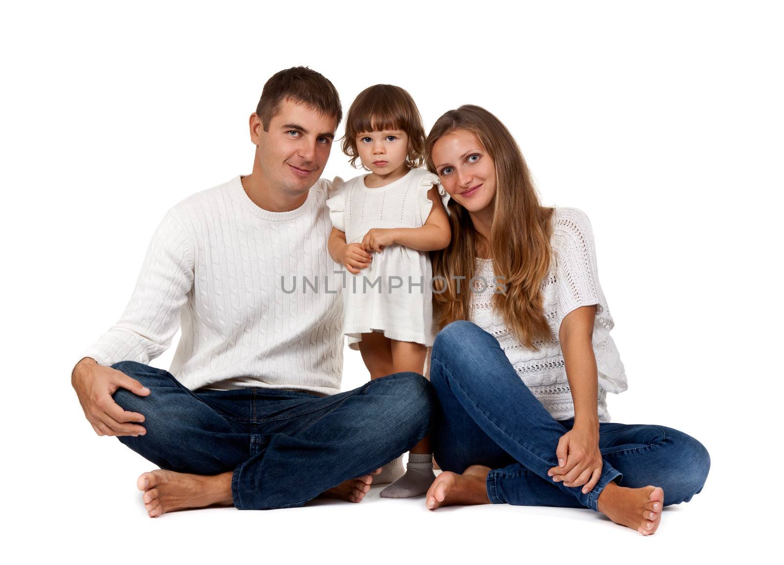 happy family sitting in the studio on a white background