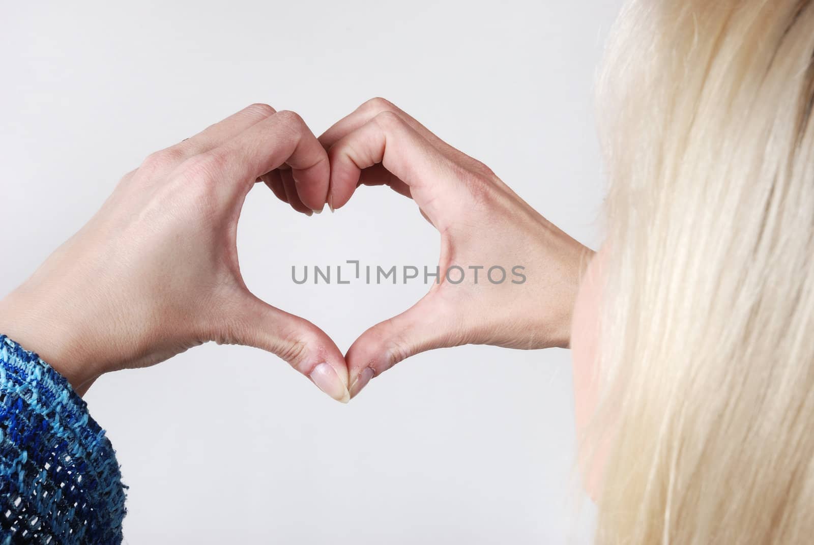 Woman making heart shape with her hands