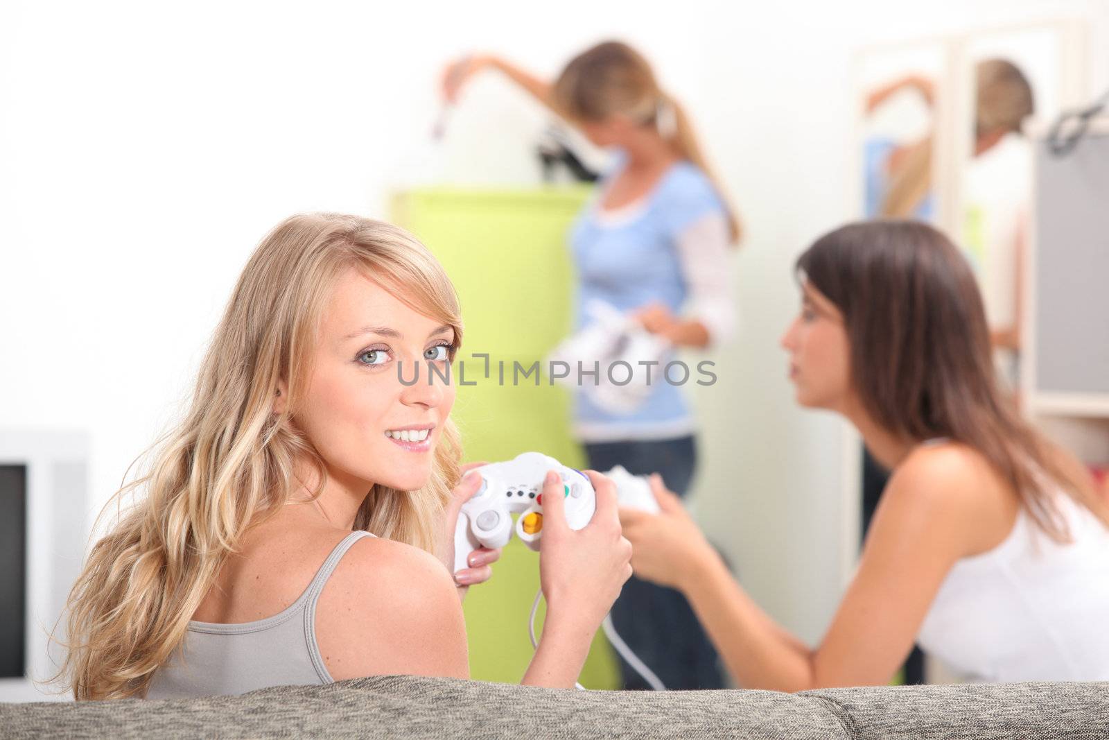 Girlfriends playing computer games by phovoir