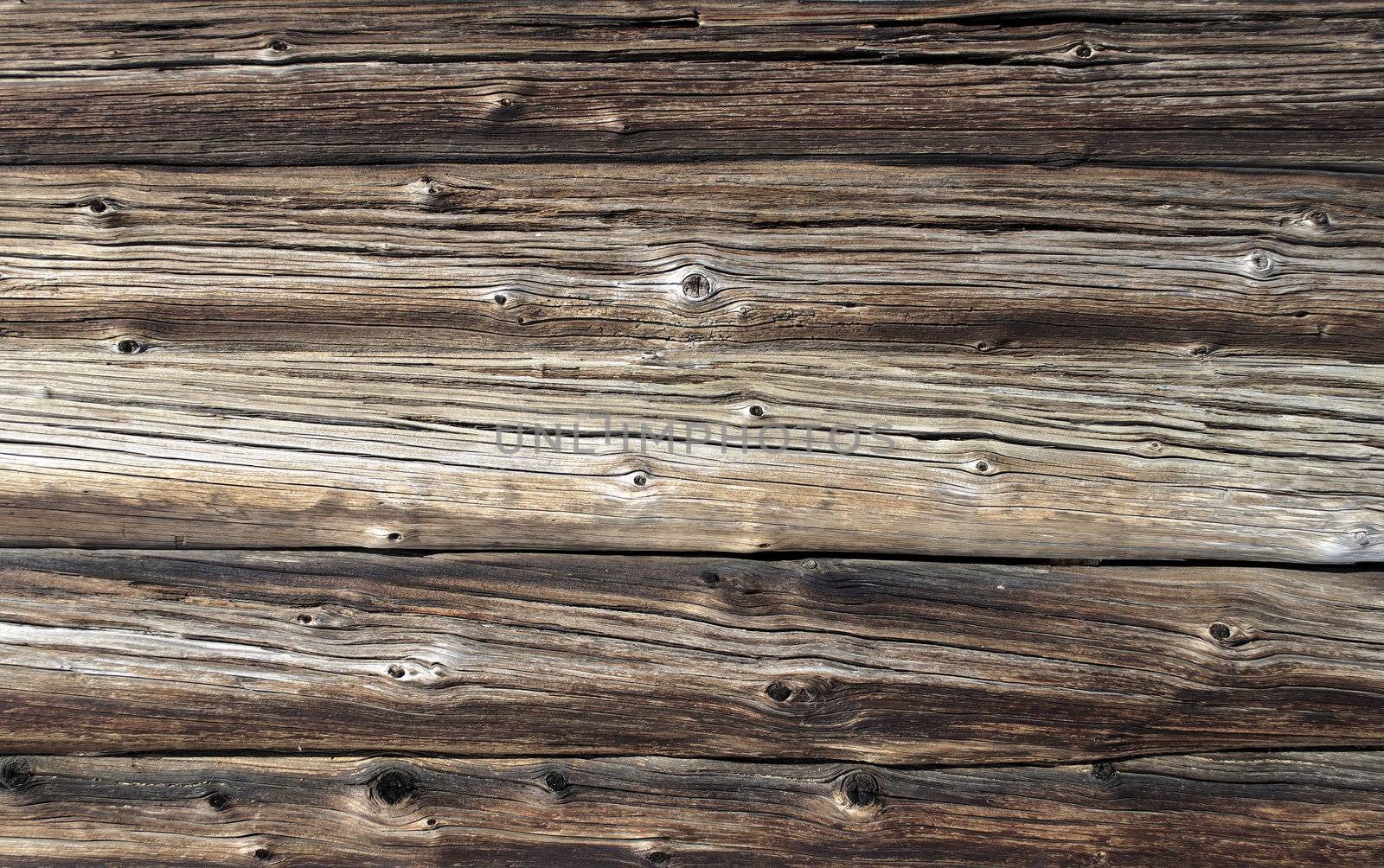 Fragment of old weathered log wall